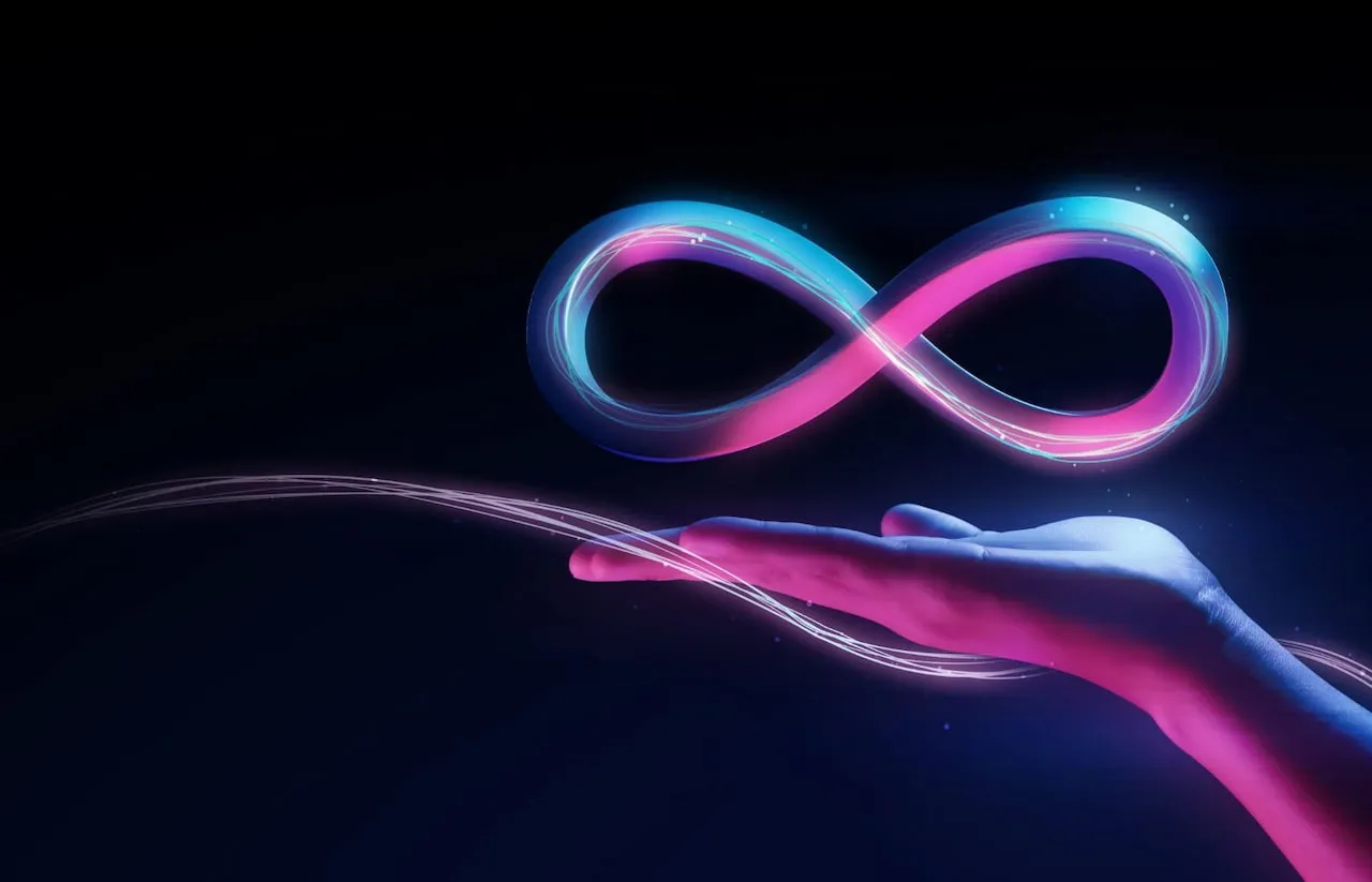 Svietiace neónové logo symbolu Meta v modrej a ružovej farbe